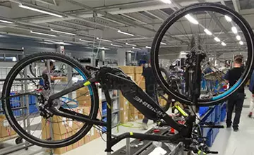 How do manufacturing process audits improve e-bike production quality?